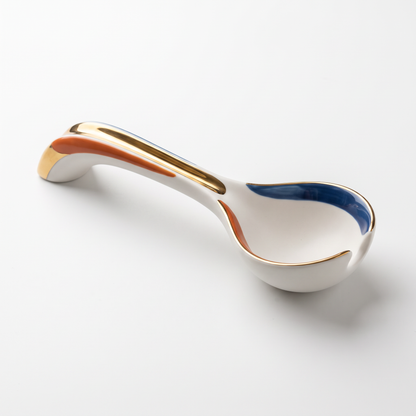 White Ceramic Soup Spoon with Blue, Orange and Gold Accents
