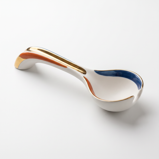White Ceramic Soup Spoon with Blue, Orange and Gold Accents
